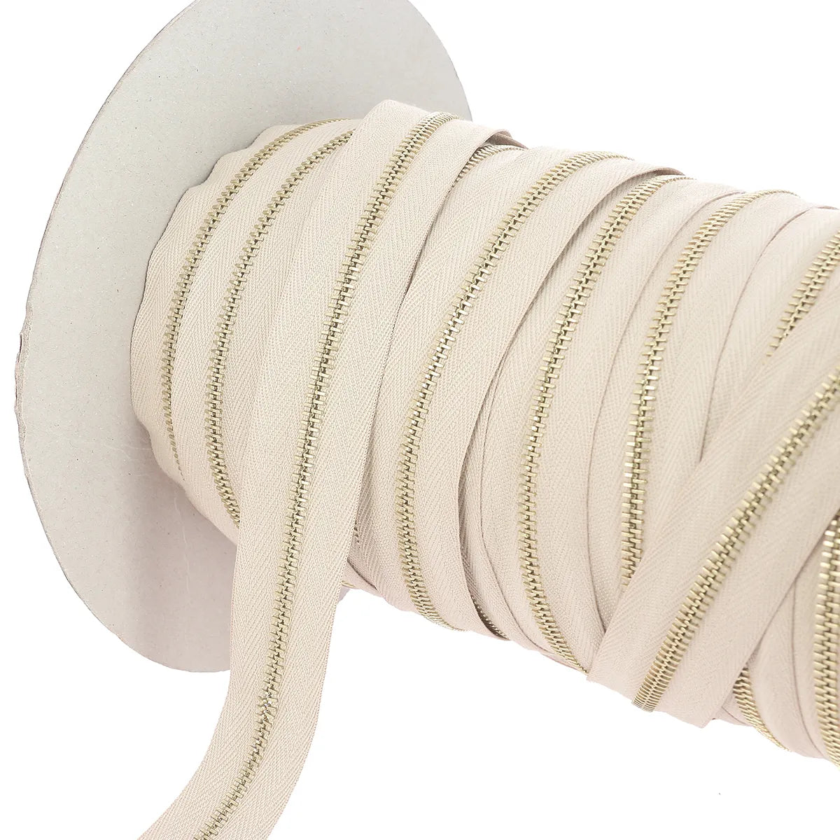 Fermeture à glissière au mètre de couleur beige finition métal laiton largeur 4 mm