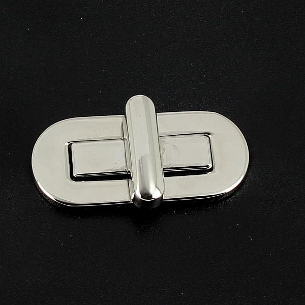 Fermoir tourniquet en nickelé, 40x18 mm, accessoire pour bijoux, visible dans l'image.