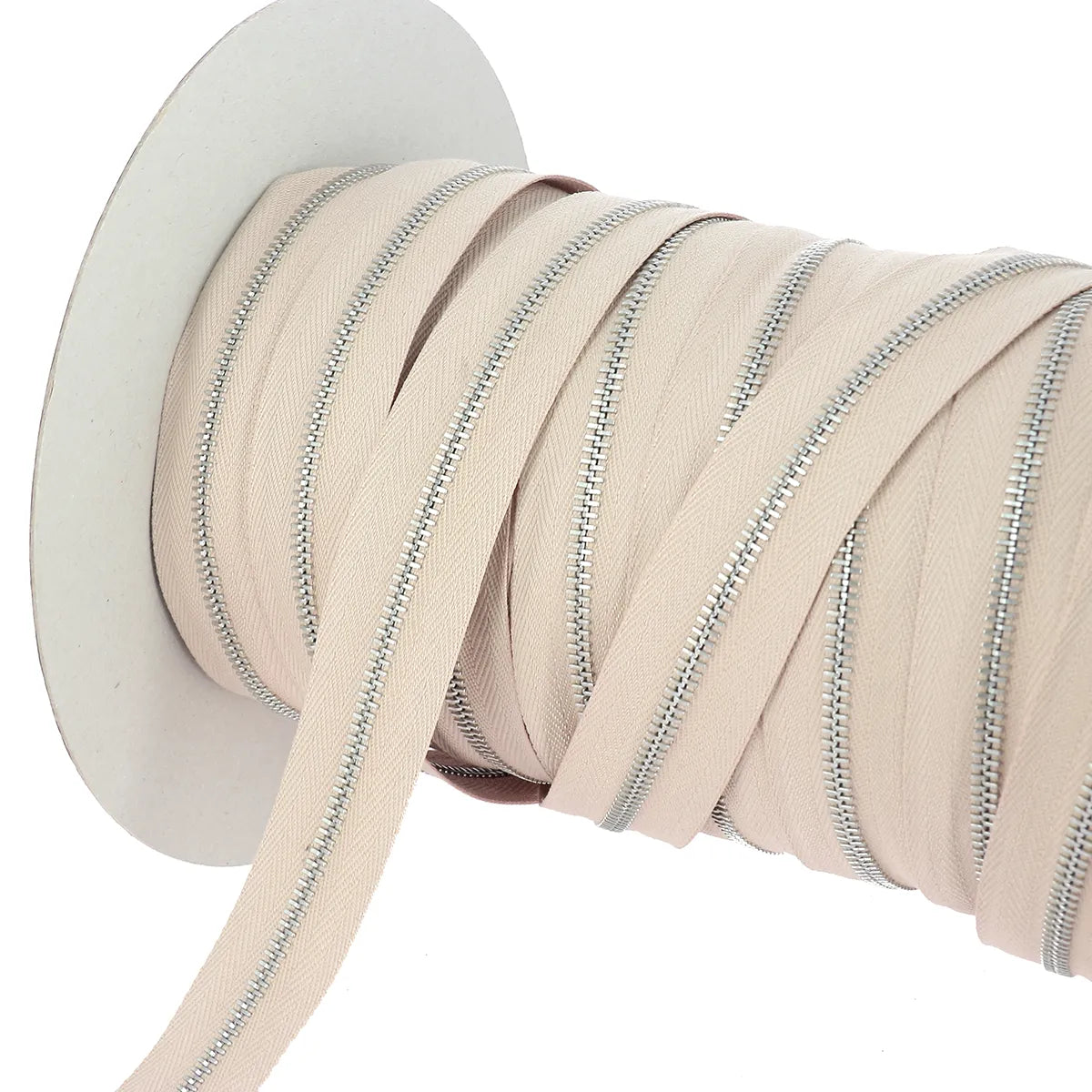 Fermeture zippée beige largeur 4 mm en finition nickelé pour couture