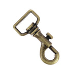 Mousqueton tournant à tirette en laiton vieilli, 70 mm de hauteur, pour bouclerie, avec boucle tournante et mécanisme sécurisé.