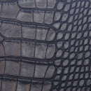 Peau entière de cuir de basane imitation crocodile bleue marine, souple et élégante, pour projets de maroquinerie ou décoration.