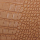 Peau de cuir de basane imitation crocodile en nubuck couleur cognac, finition authentique, pour projets de maroquinerie ou décoration.