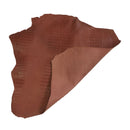 Peau entière de cuir de basane imitation crocodile, couleur marron brique, finition aniline, fabriquée en France.