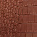 Peau de cuir de basane imitation crocodile, couleur marron brique, finition aniline, texture réaliste.