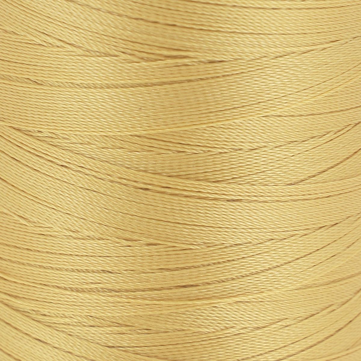 Bobine de fil polyester GRAL N°30 Ambre, 1000m, marque Coats, mercerie, vue détaillée du fil sur la bobine.