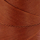 Bobine de 100m de fil polyester tressé et ciré de 0,6mm en rouille, produit de mercerie avec image de la bobine.