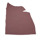Peau de cuir de veau grainé couleur vieux rose, authentique, texture détaillée, pour projets de maroquinerie ou couture.