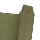 Peau de cuir grainé vert foncé métallisé. Cuir mi-souple mi-ferme idéal pour la création de maroquinerie