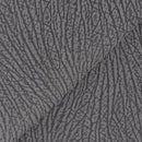 Zoom sur le cuir nubuck avec sa finition veloutée et son motif d'écorce d'arbre.