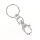 Mousqueton tournant avec anneau en nickel, bouclerie robuste pour applications diverses, image montrant le produit.
