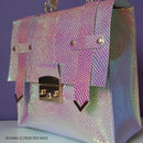 Pièce en métal pour sac en cuir, 23x23mm, accessoire de mode durable et élégant, visible dans l'image.