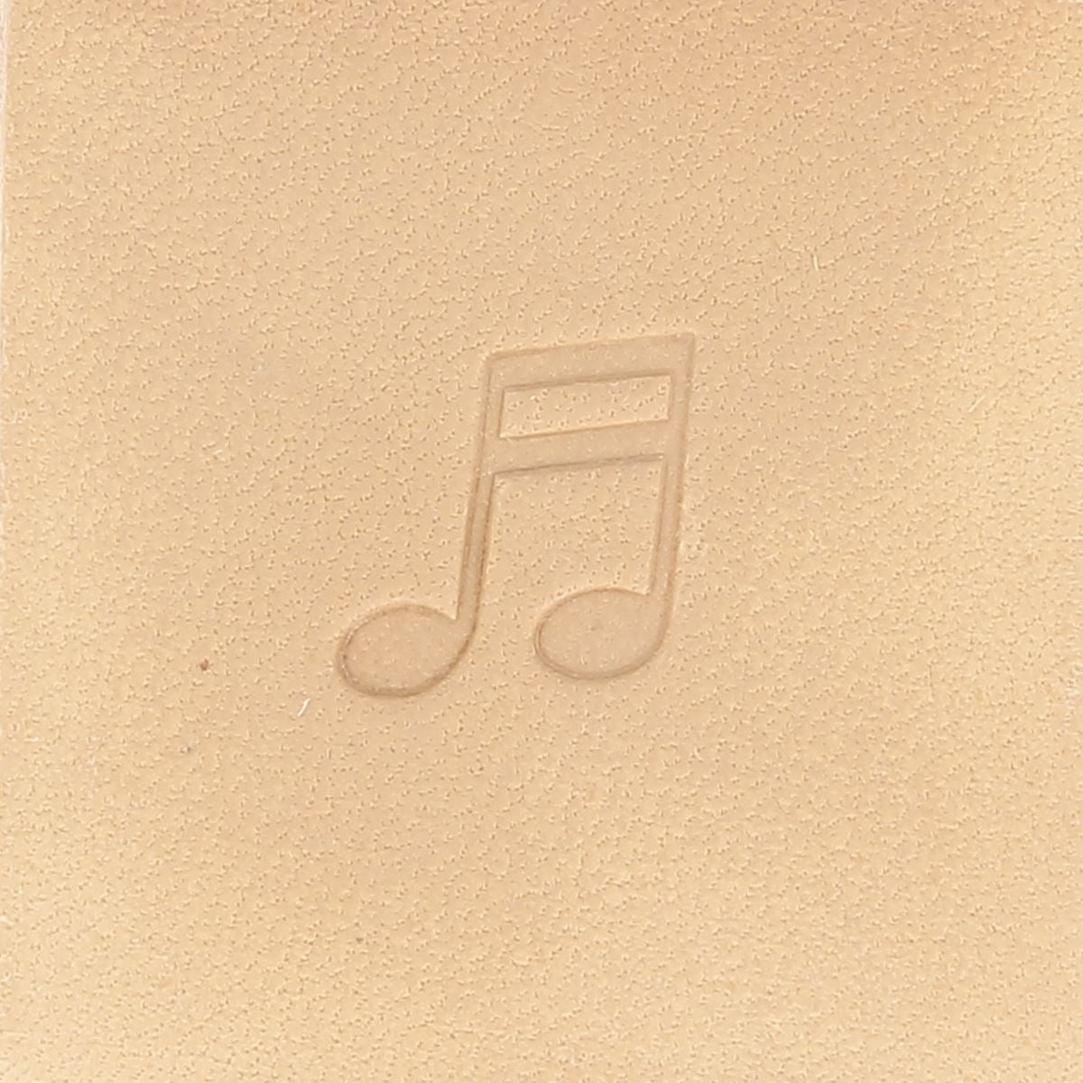 Outil Matoir sur manche Tandy Leather avec note de musique gravée, utilisé pour le travail du cuir.