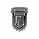 Fermeture de cartable TUCK Autres, 23x30mm, accessoire pour sac ou bagage, en métal, avec mécanisme de fixation.