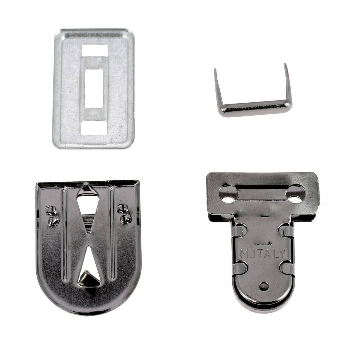 Fermeture de cartable TUCK de 23x30mm, accessoire de marque Autres, visible en détail sur cette image.