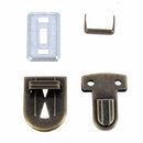 Fermeture de cartable TUCK Autres, 23x30mm, accessoire pour sac ou valise, en métal, visible sur l'image.