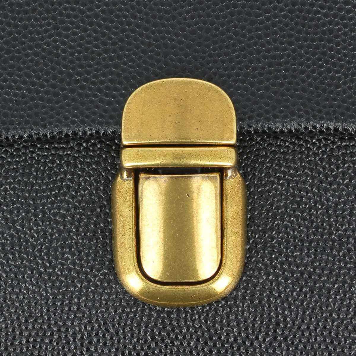 Fermeture de cartable TUCK de 20x36mm, accessoire pour sac, en métal avec mécanisme de clip, image montrant la fermeture en détail