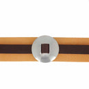 Concho à lacer Lisse en inox d'Ivan, accessoire métallique brillant, montrant la surface lisse et le design élégant.