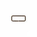 Passant rectangulaire en laiton vieilli, bouclerie fine, 25x8mm, pour bijoux ou créations artisanales.