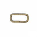Passant rectangulaire en laiton vieilli avec angles arrondis, fil 4mm, utilisé en bouclerie pour créations de bijoux.
