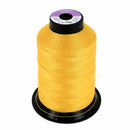 Bobine de fil polyester GRAL N°40 Coats, 1000m, jaune, mercerie pour couture robuste, visible sur la bobine en image.