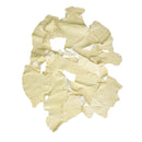 Chutes de cuir d'autruche vanille de 1 kg avec découpes, fabriqué par Deco Cuir, pour projets de maroquinerie et artisanat.