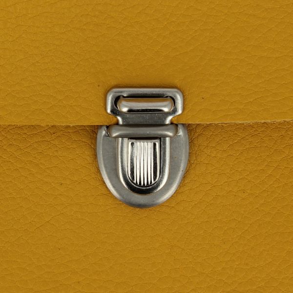 Fermeture de cartable TUCK en nickel, accessoire pour sac, 15x21 mm, montrée sur une image avec détails de la fermeture.