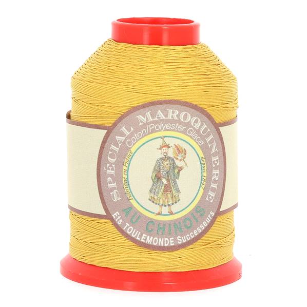 Fil au Chinois, bobine de 500m de fil polyester coton spécial maroquinerie jaune 0,52mm, pour travaux de maroquinerie.