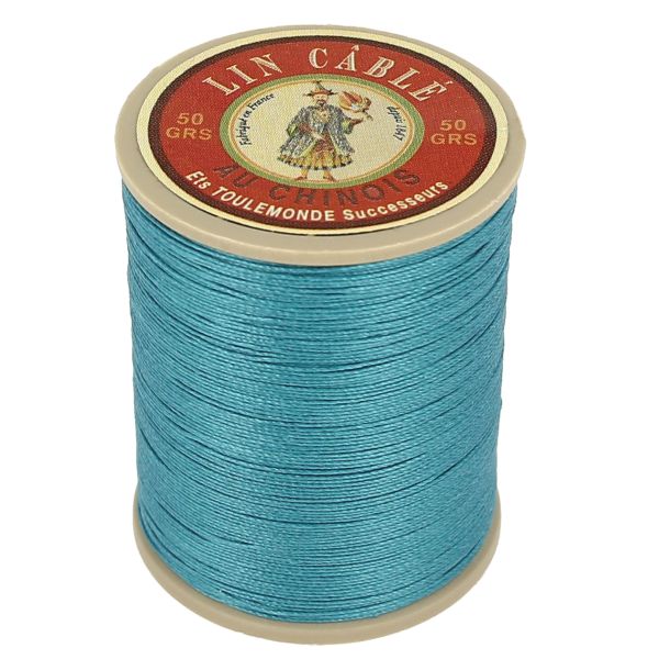 Bobine de 375m de fil de lin câblé glacé AU CHINOIS, couleur bleu canard 863, vue verso, utilisée en mercerie.