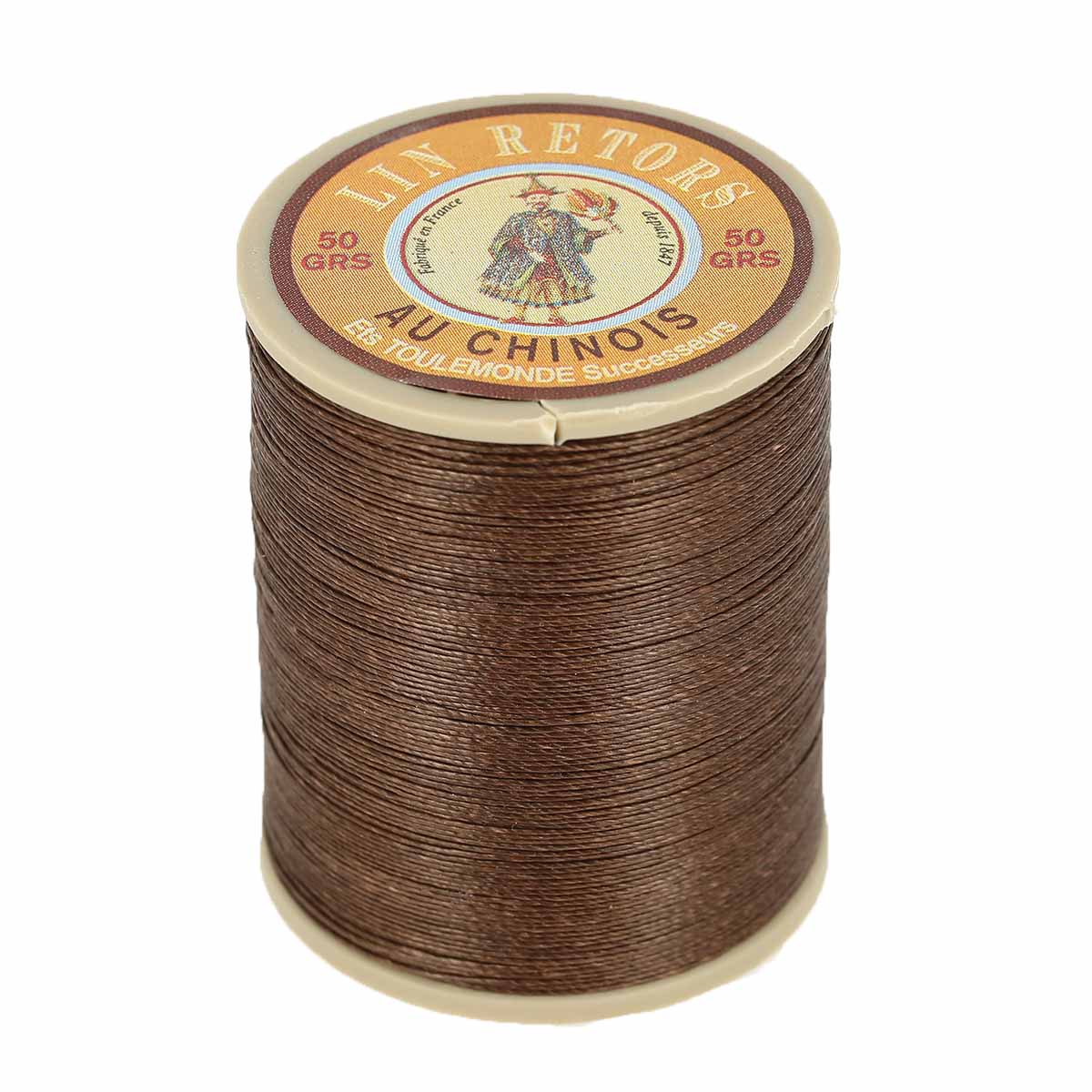 Bobine de 266m de fil de lin retors extra glacé n°24 de la marque Fil au Chinois, couleur havane.