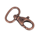 Mousqueton tournant en vieux cuivre de 20 mm, bouclerie résistante pour la fixation et la sécurisation.
